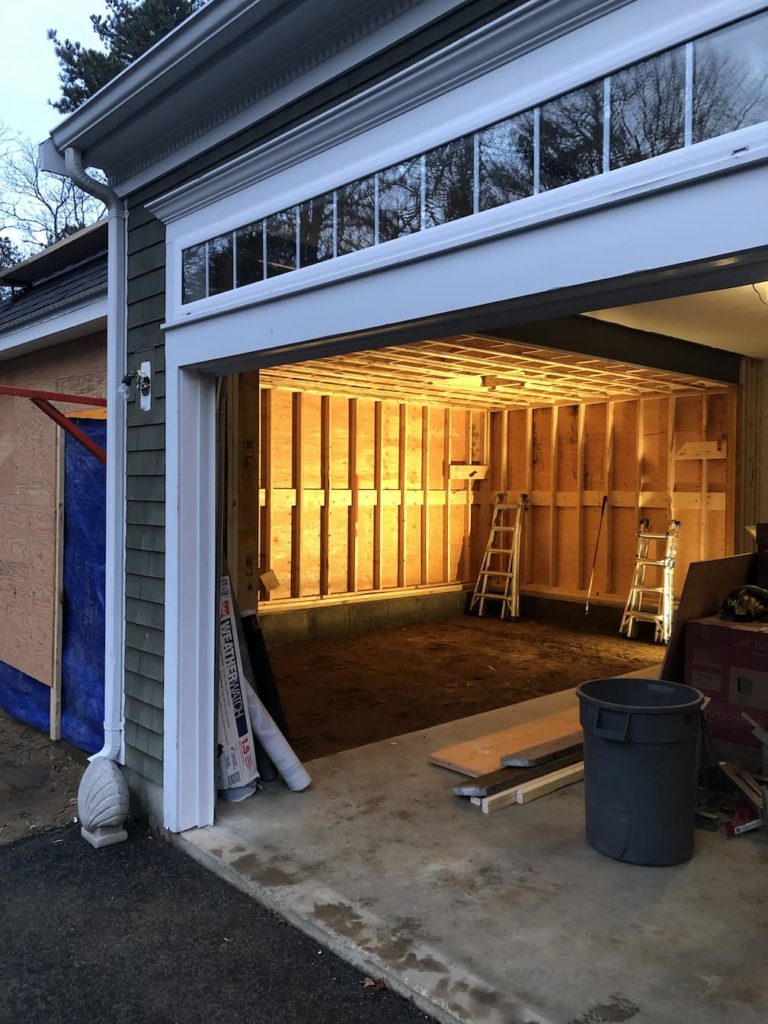 Home garage addition sheathed interior completed