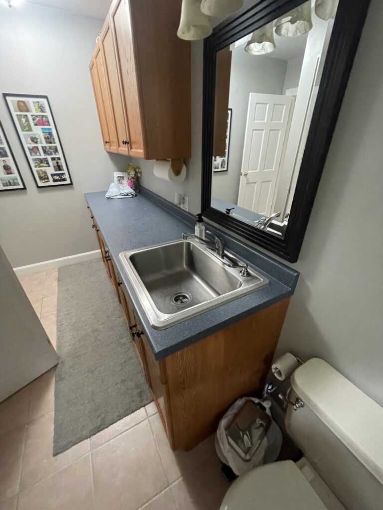 Kingston kitchen remodel nook with outlets and illuminated glassware cabinet