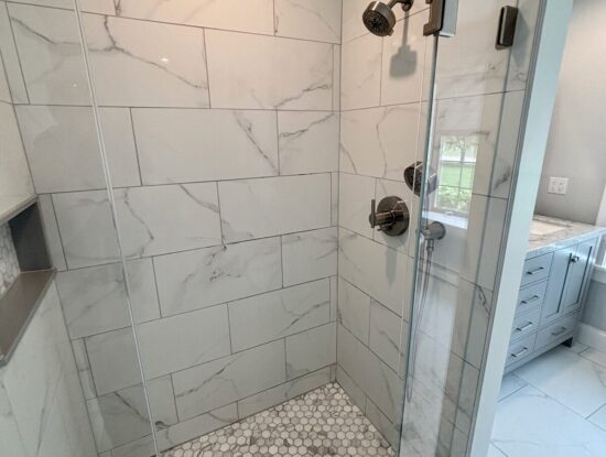 Kingston master bathroom remodel featuring a new porcelain tile shower