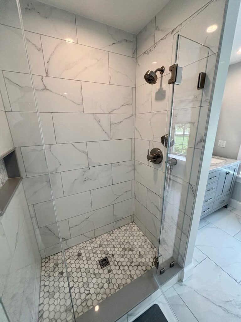 Kingston master bathroom remodel featuring a new porcelain tile shower